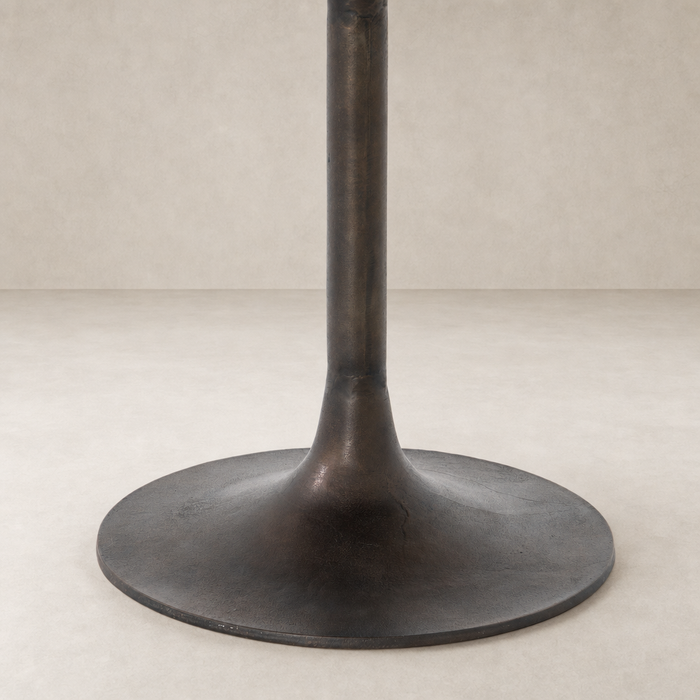 Antique Rust Kensington Bistro Table featuring a sleek, round base and sturdy support.