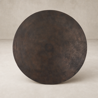 Kensington Bistro Table in antique rust with a smooth, round surface and rustic finish.