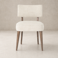 Orson Dining Chair in Cambric Ivory with a chic, minimalist design and wooden legs.