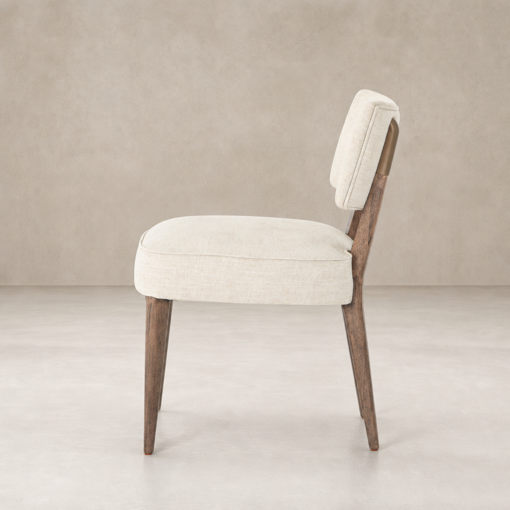 Orson Dining Chair in Cambric Ivory with tapered wooden legs and plush cushioning.