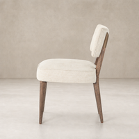 Orson Dining Chair in Cambric Ivory with tapered wooden legs and plush cushioning.