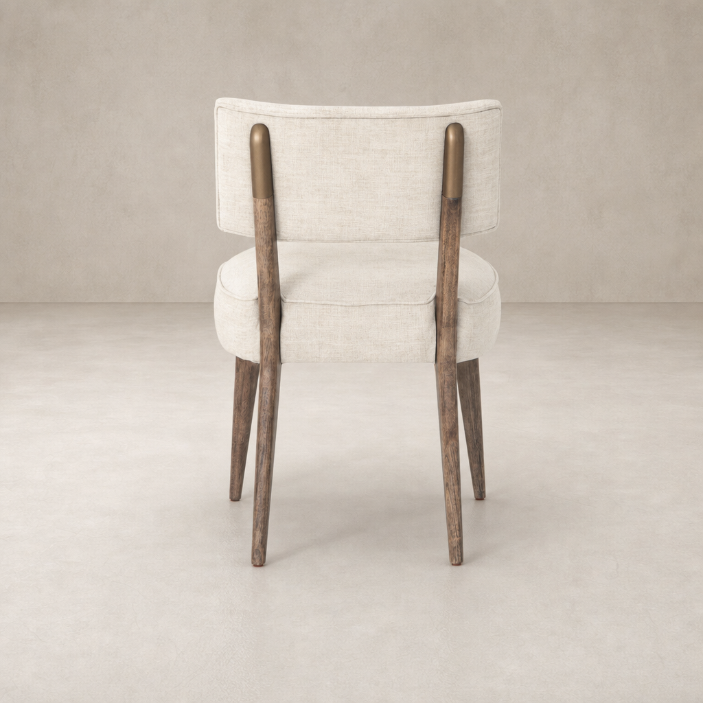 Orson Dining Chair in Cambric Ivory with wooden legs and stylish backrest.