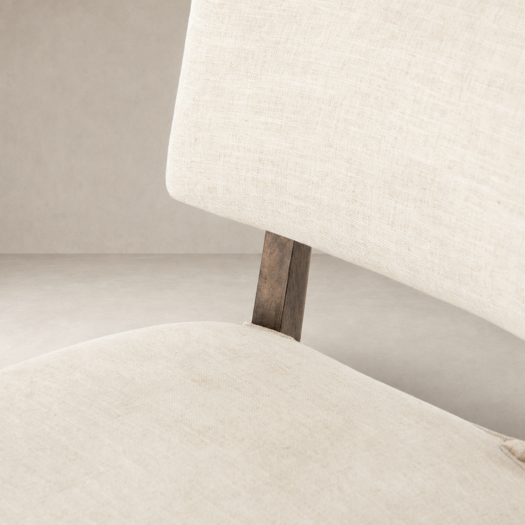 Orson Dining Chair in Cambric Ivory, showcasing textured upholstery and wood support.
