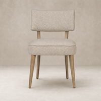 Orson Dining Chair in Mortensen Linen with a cushioned seat and wooden legs.
