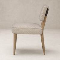 Orson Dining Chair in Mortensen Linen with sleek wooden legs and plush cushioning.