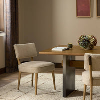 Orson Dining Chair upholstered in Mortensen Linen, featuring a modern design with tapered legs.