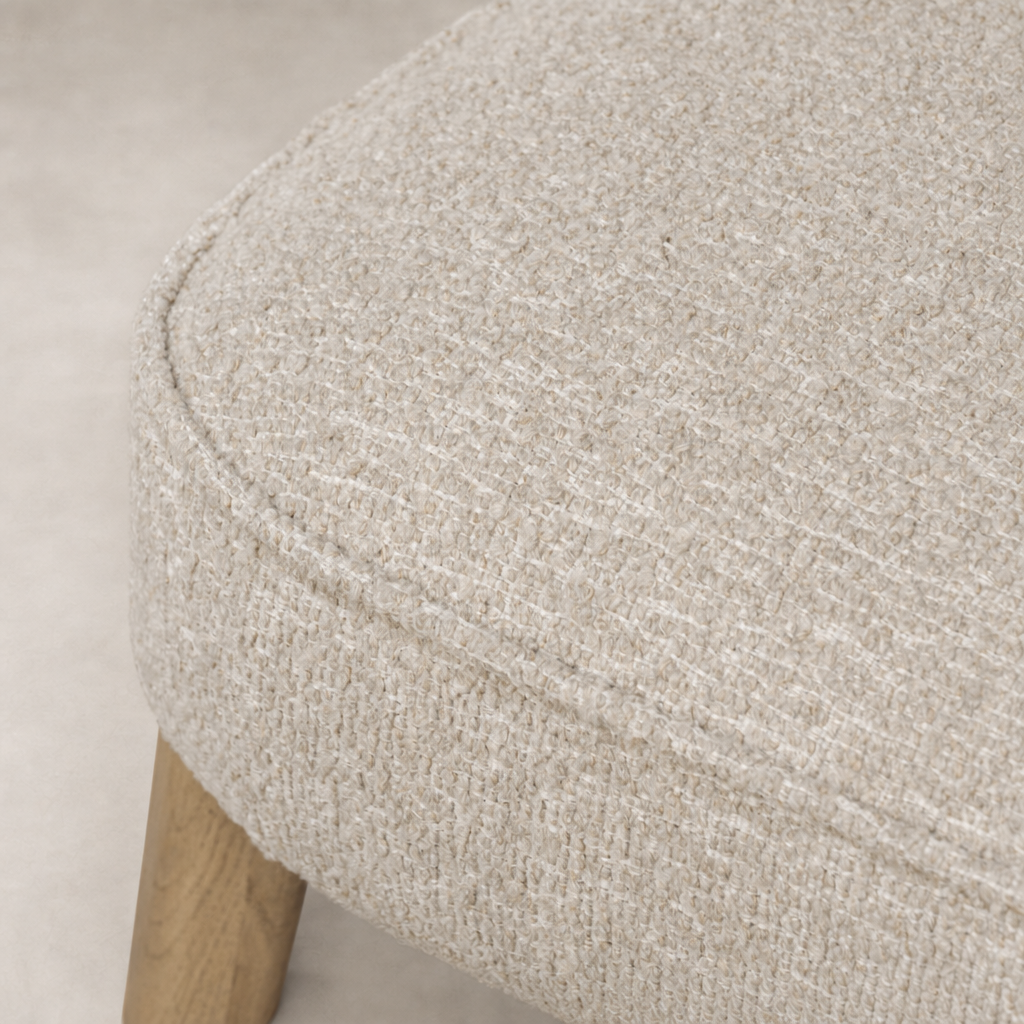 Close-up of Orson Dining Chair in Mortensen Linen, showcasing its textured fabric.