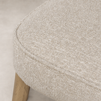 Close-up of Orson Dining Chair in Mortensen Linen, showcasing its textured fabric.