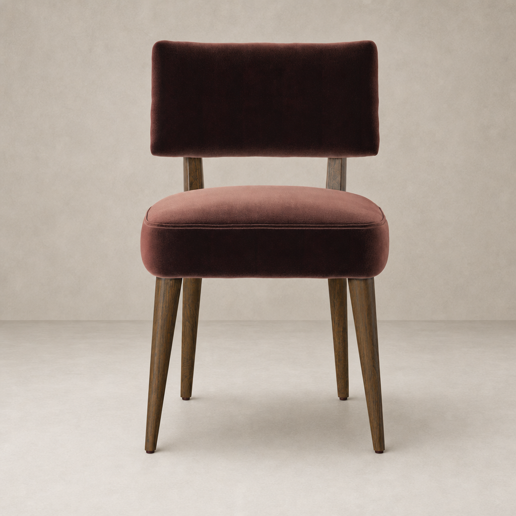 Orson Dining Chair in Surrey Plum with a sleek, modern design and wooden legs.
