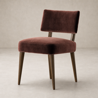 Orson Dining Chair in Surrey Plum with plush upholstery and sleek wooden legs.