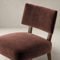 Orson Dining Chair in Surrey Plum featuring a plush seat and supportive backrest.