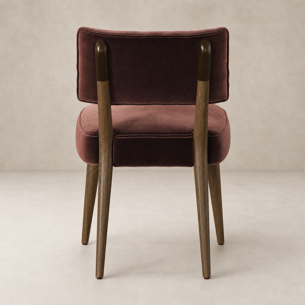 Orson Dining Chair in Surrey Plum featuring plush upholstery and tapered wooden legs.