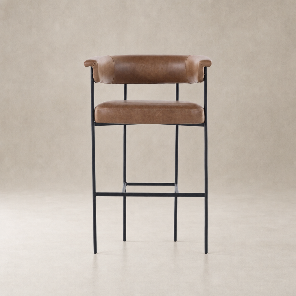 Banyan Bar + Counter Stool in Chaps Saddle with curved back and sleek metal legs.