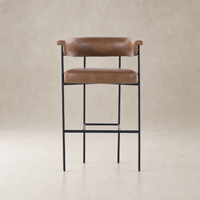 Banyan Bar + Counter Stool in Chaps Saddle with curved back and sleek metal legs.
