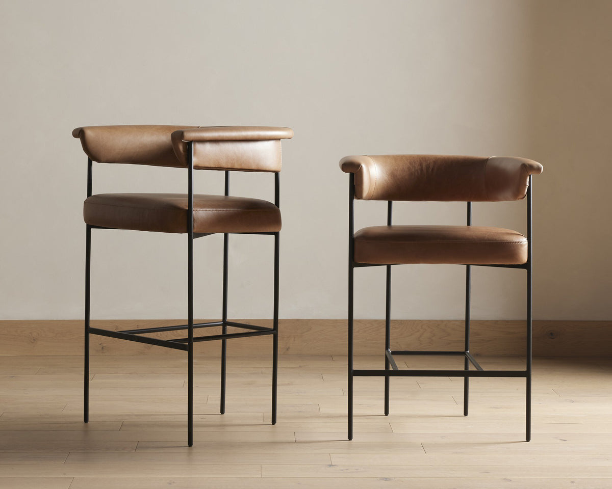 Banyan Bar + Counter Stool in Chaps Saddle with sleek black metal legs and curved back.