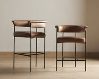 Banyan Bar + Counter Stool in Chaps Saddle with sleek black metal legs and curved back.