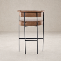 Banyan Bar + Counter Stool in Chaps Saddle with sleek metal frame and comfortable upholstery.