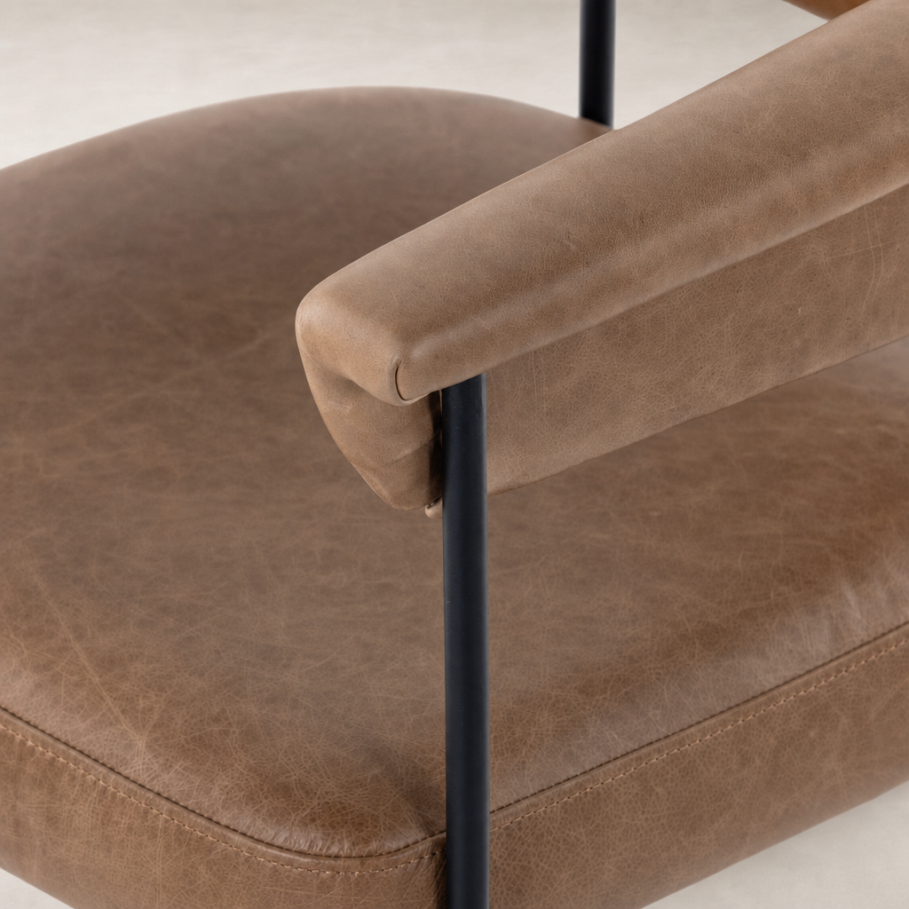 Banyan Bar + Counter Stool featuring Chaps Saddle leather with a sleek black frame.