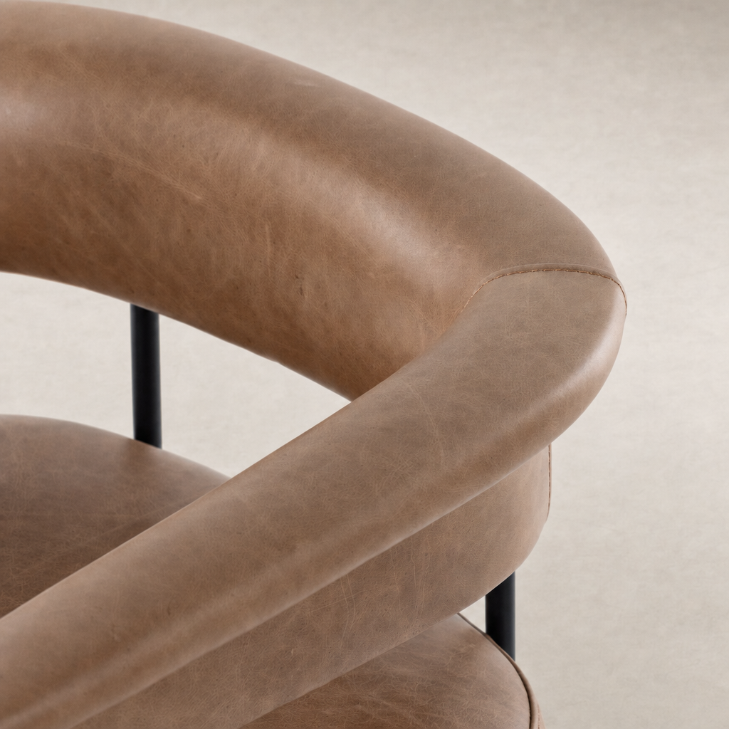 Close-up of the Banyan Bar + Counter Stool in Chaps Saddle leather with sleek curves.
