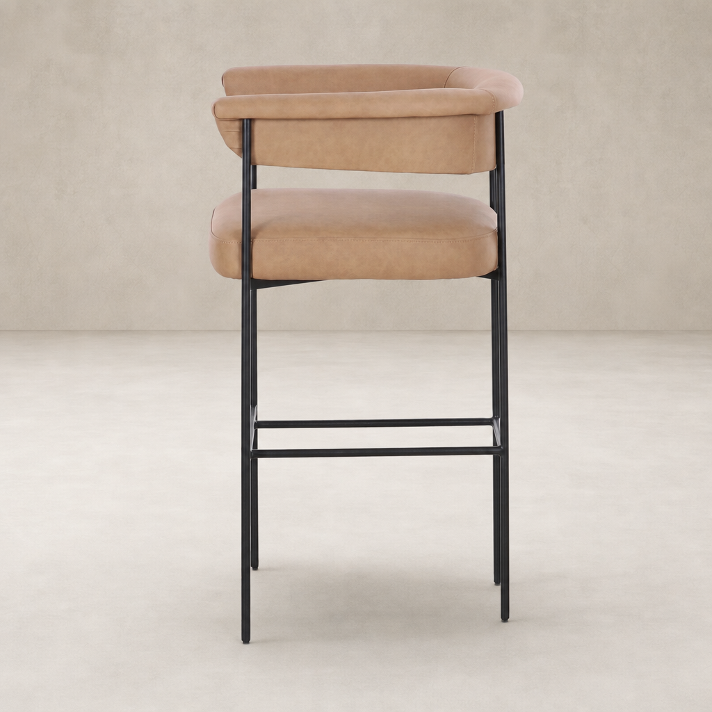 Banyan Bar + Counter Stool in Maestro Camel with sleek metal legs and curved backrest.