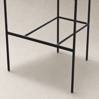 Banyan Bar + Counter Stool in Maestro Camel with sleek black metal legs.