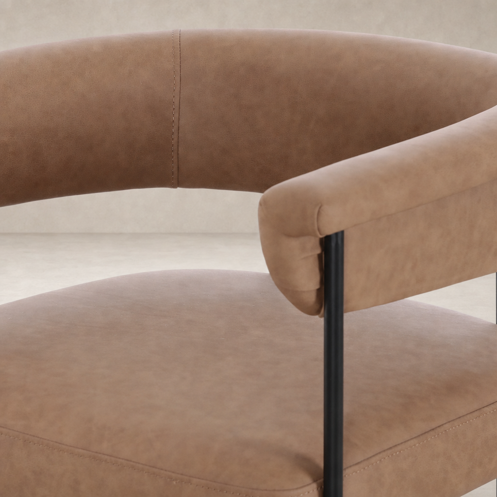 Banyan Bar + Counter Stool in Maestro Camel featuring a sleek curved design and soft upholstery.