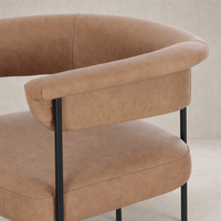 Banyan Bar + Counter Stool in Maestro Camel with curved armrest and soft texture.