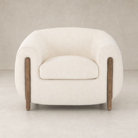 Clover Chair in Kerbey Ivory with soft upholstery and wooden accents.