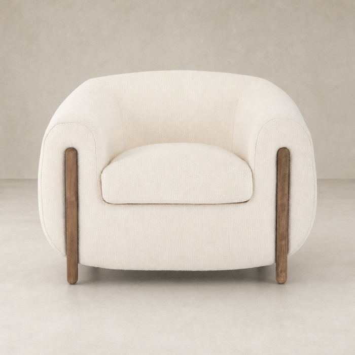 Clover Chair in Kerbey Ivory with soft upholstery and wooden accents.