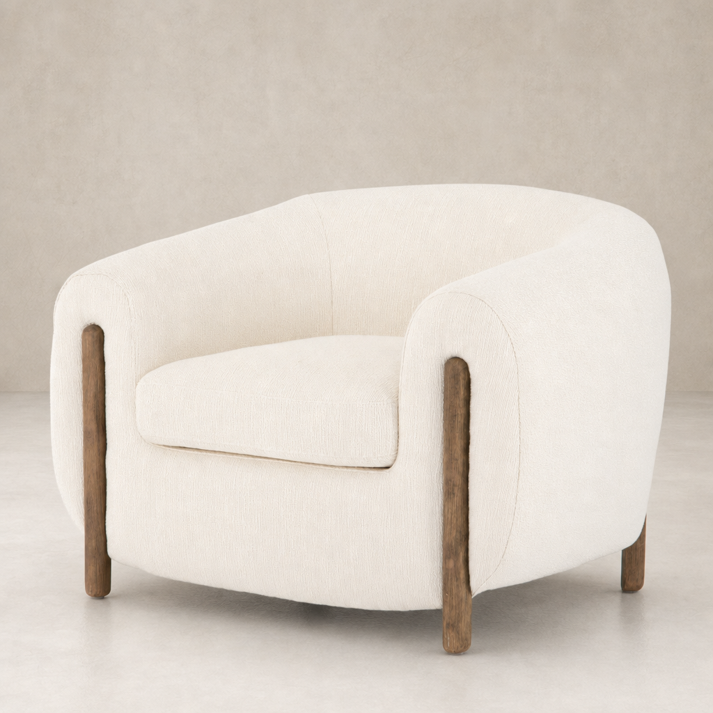 Clover Chair in Kerbey Ivory with rounded contours and wooden legs.
