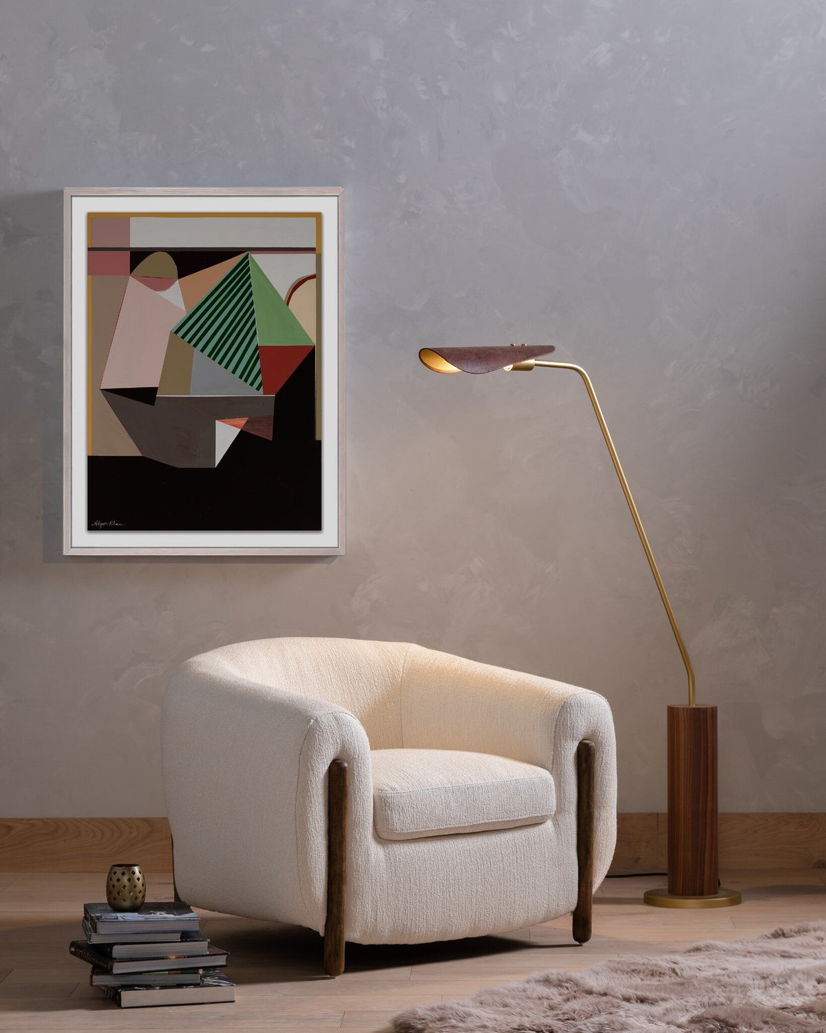 Clover Chair in Kerbey Ivory with curved shape and wooden accents in modern setting.
