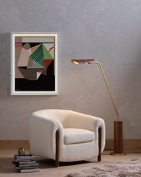 Clover Chair in Kerbey Ivory with curved shape and wooden accents in modern setting.