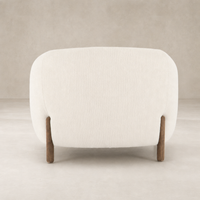 Clover Chair in Kerbey Ivory with rounded back and wooden legs.