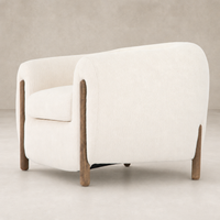 Clover Chair in Kerbey Ivory with rounded design and wooden accents.