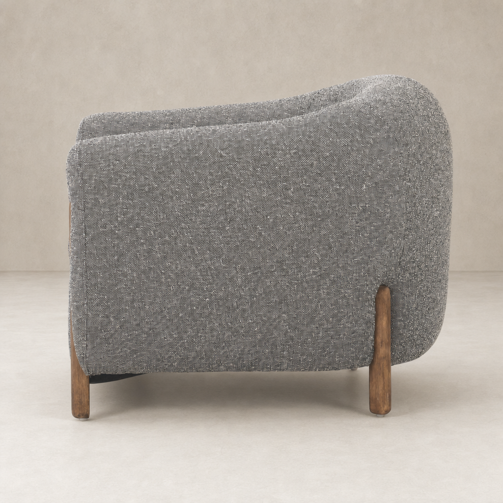 Clover Chair in Capri Ebony with curved design and wooden legs.