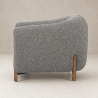 Clover Chair in Capri Ebony with curved design and wooden legs.
