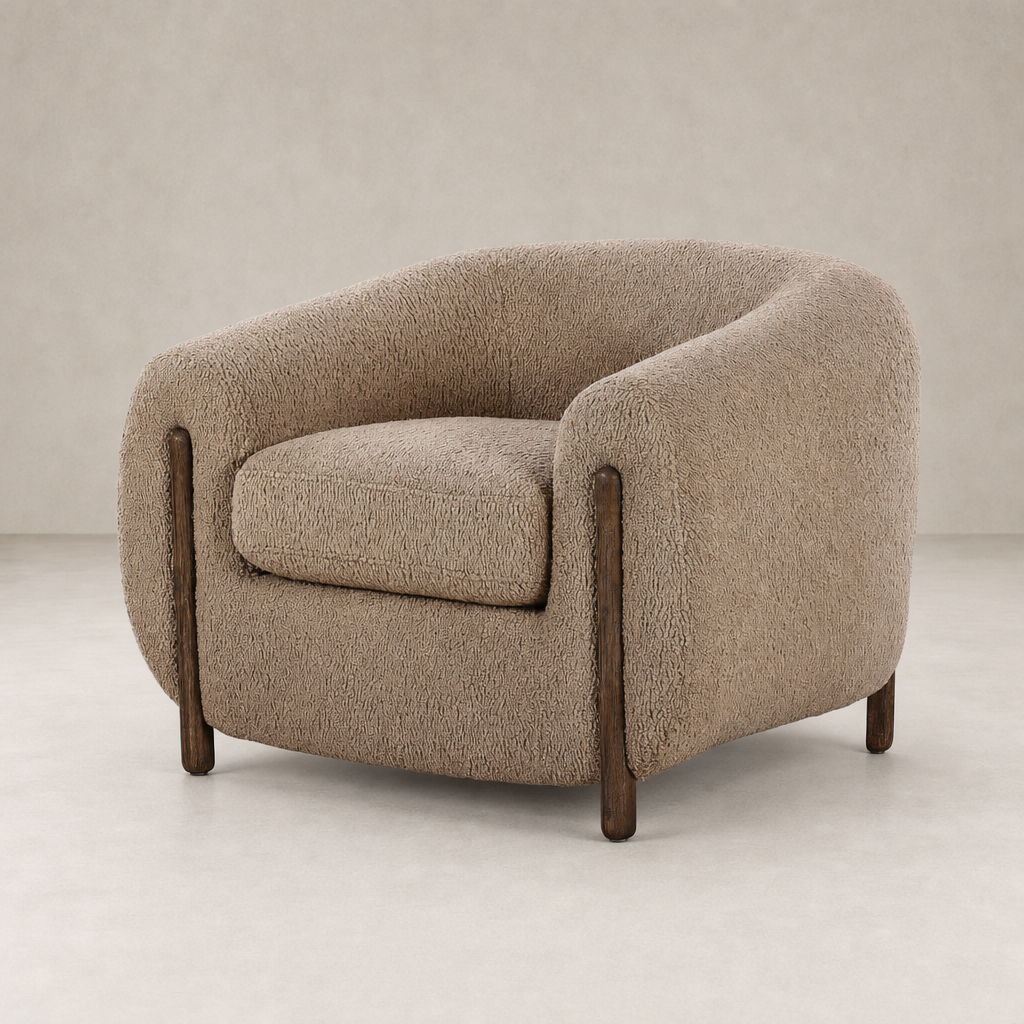 Clover Chair in Sheepskin Camel with round shape and wooden legs.