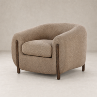 Clover Chair in Sheepskin Camel with round shape and wooden legs.