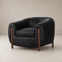 Clover Chair in heirloom black with curved arms and wooden legs, perfect for modern spaces.