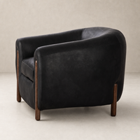Clover Chair in heirloom black featuring a sleek, curved design and wooden legs.