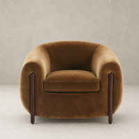 Clover Chair in Surrey Ochre with plush upholstery and sleek wooden legs.