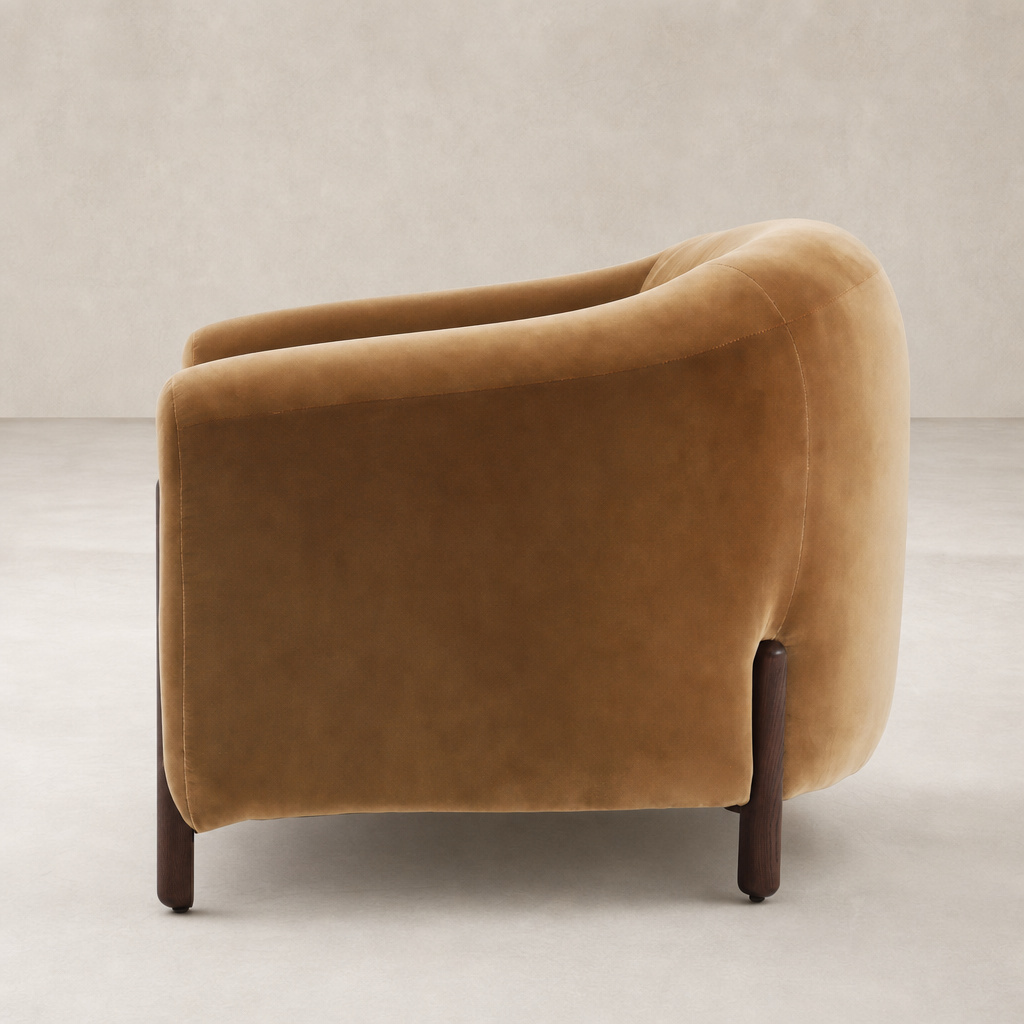Curved Surrey Ochre Clover Chair with elegant wooden legs and soft upholstery.