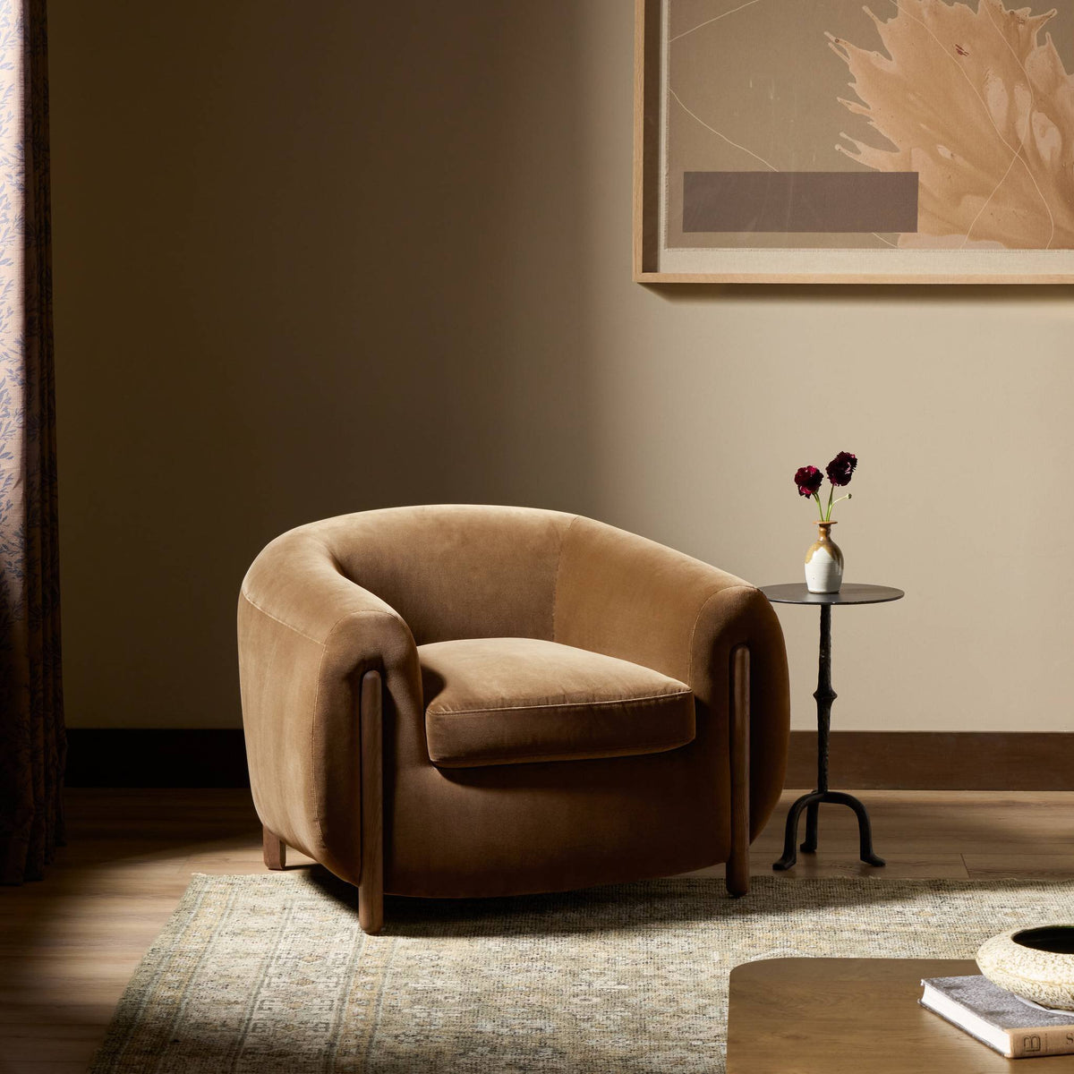 Clover Chair in Surrey Ochre featuring a rounded design and plush upholstery.