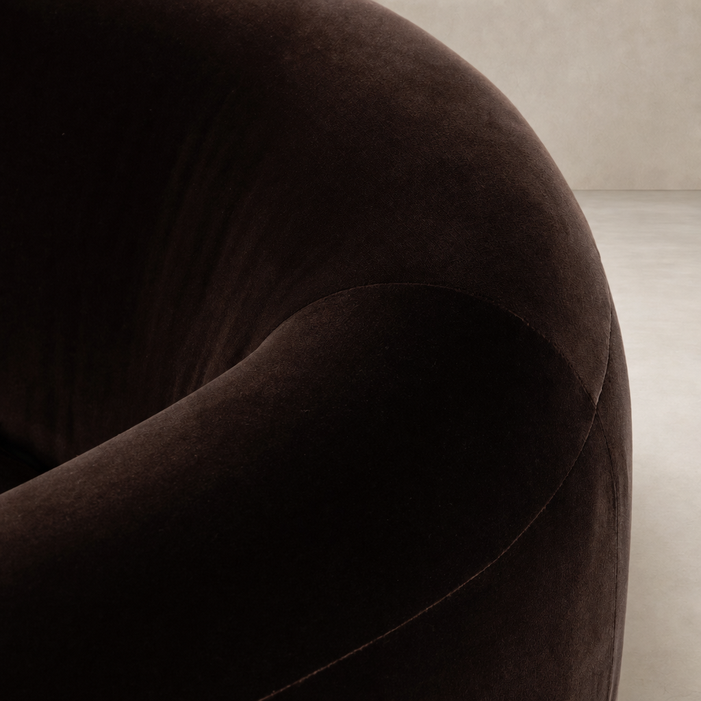 Clover Chair in Surrey Cocoa featuring a soft, rounded velvet texture and elegant curves.