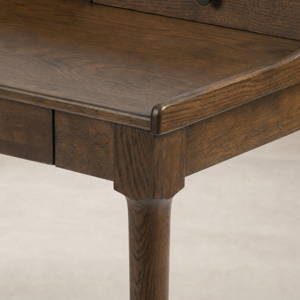Quince Desk in Dark Toasted Oak featuring a smooth surface and elegant tapered legs.