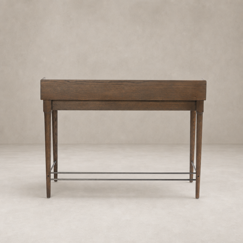 Quince Desk in dark toasted oak with sleek lines and elegant tapered legs.