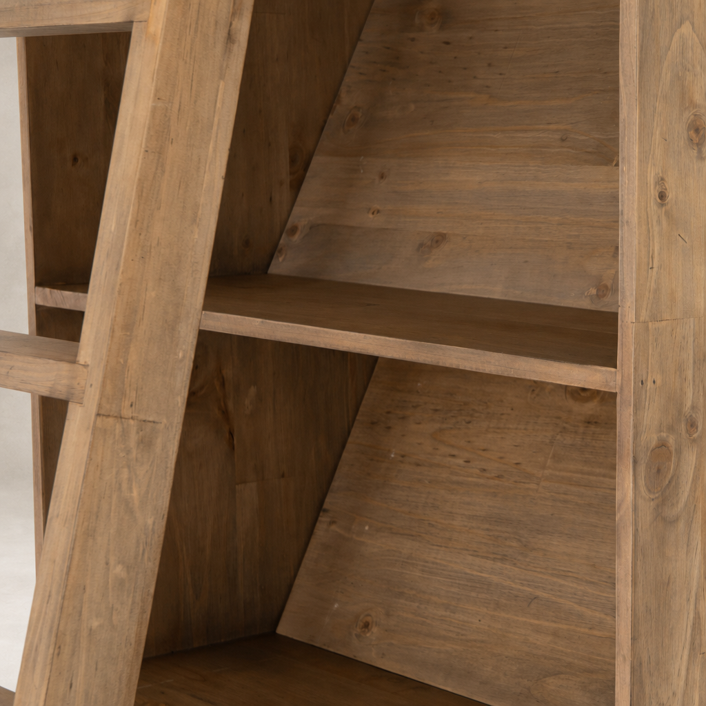 Tahoe Bookshelf in smoked pine with a slanted shelf design and natural finish.