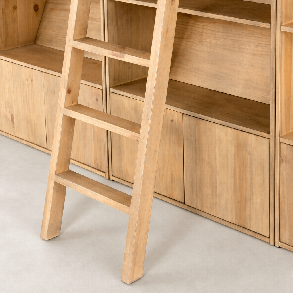 Tahoe Bookshelf in Smoked Pine with a ladder against its spacious, open shelves.