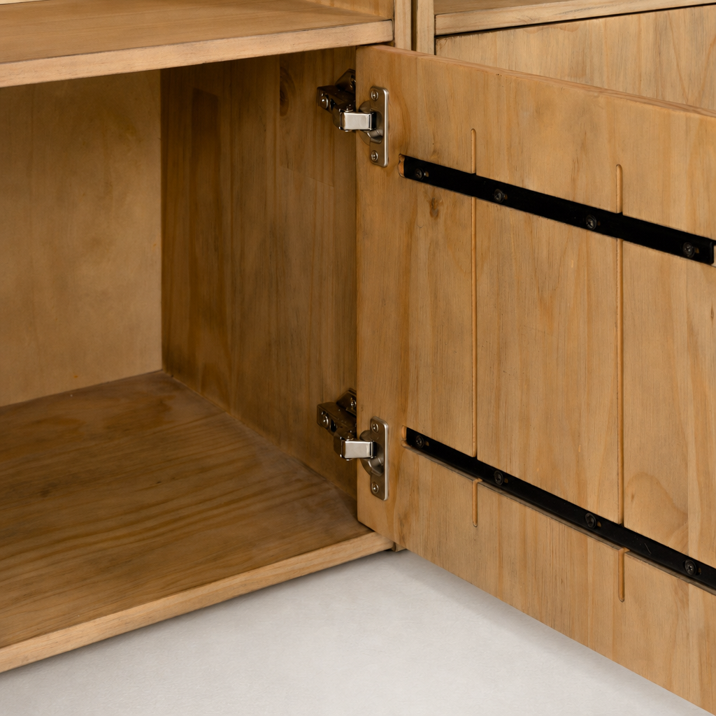 Close-up of Tahoe Bookshelf's smoked pine door and sleek metal hinge detail.