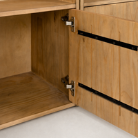 Close-up of Tahoe Bookshelf's smoked pine door and sleek metal hinge detail.